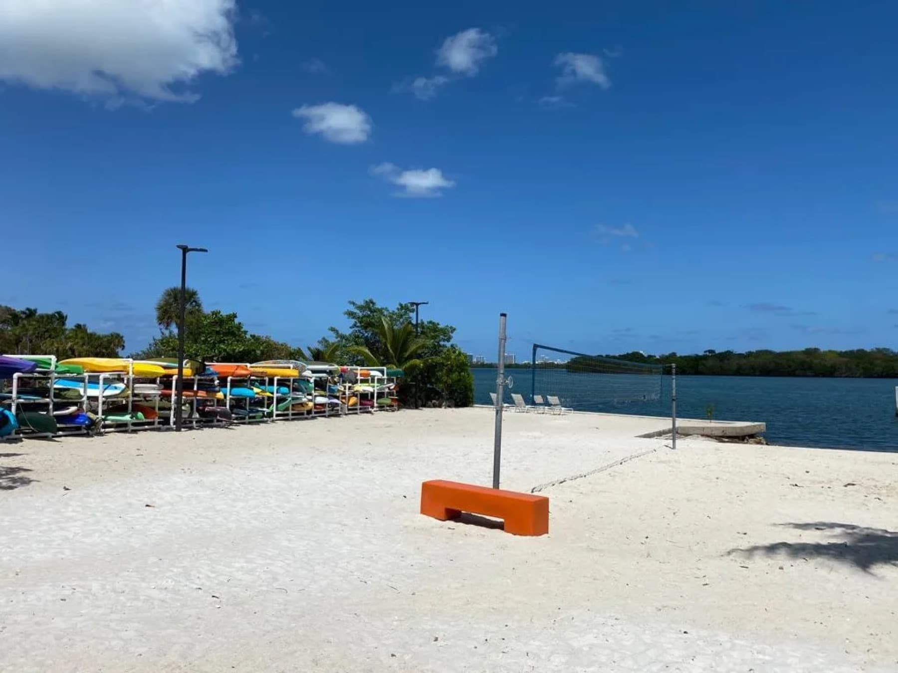 Private beach with volleyball court and shaded seating